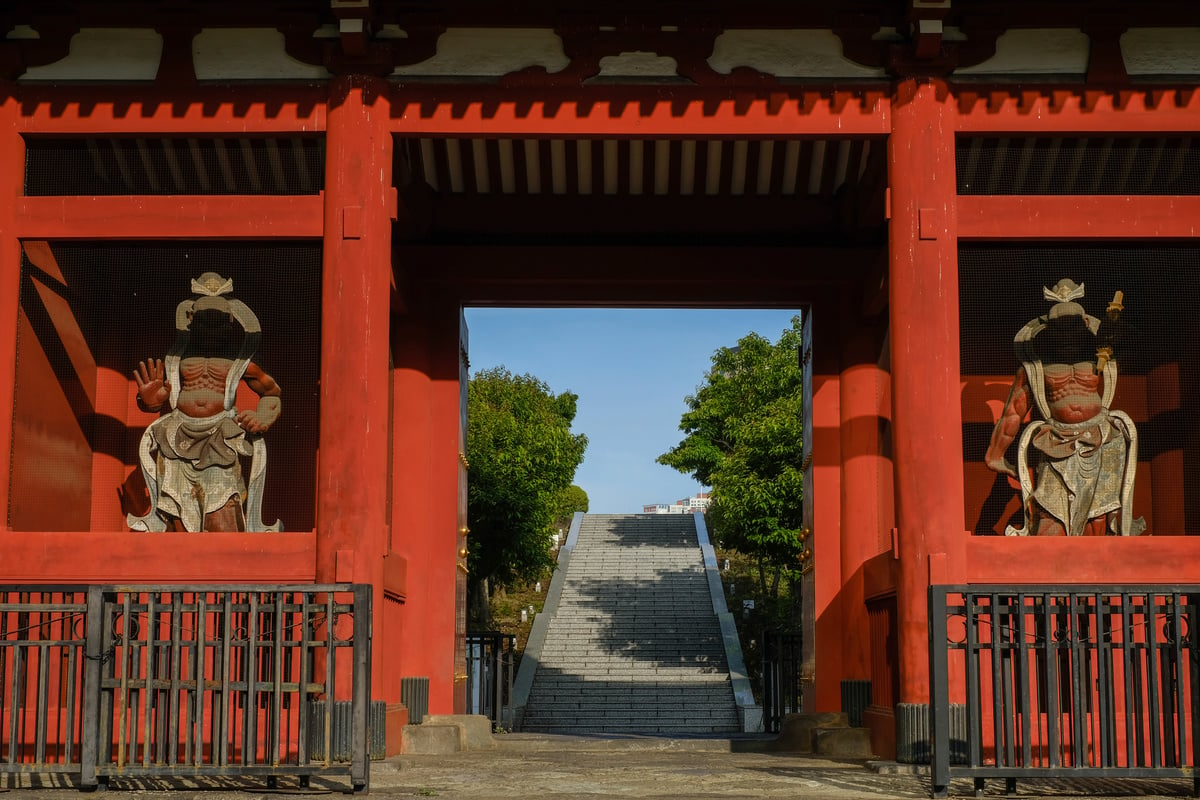 Red Torii with Wooden Statues of Gods